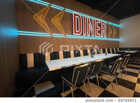 typical american diner with a checkered floor 89789451