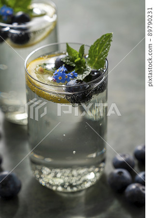 Detox water, infused refreshing drink with lemon and blueberry and mint. Detox water, infused refreshing drink with lemon and blueberry and mint. 89790231