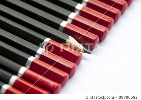 One pencil turning out from the group of other pencil. Leadership concept. 89790682