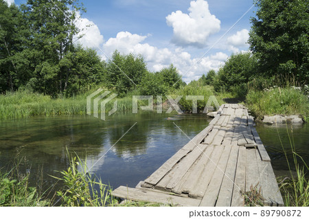 Year landscape with timber stream on background blue sky 89790872