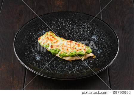 Fried fish fillet with green salsa sauce 89790993
