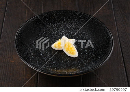 Half of boiled egg cut on two pieces 89790997