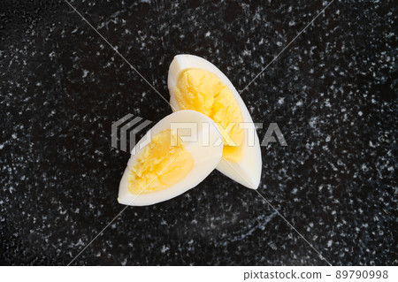 Overhead view of half of boiled egg cut on two pieces 89790998