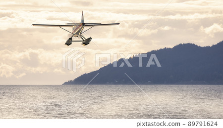 Seaplane flying over Canadian Mountain Nature Landscape on the Pacific West Coast 89791624
