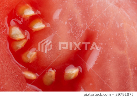 Macro photo of half cut tomato slice with seeds. Tomato slice texture. Macro photo of half cut tomato slice with seeds. Tomato slice texture. 89791875