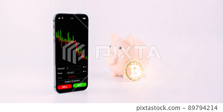 Bitcoin trading. Exchange bitcoin mobile phone app. Gold crypto currency BTC bitcoin, pink pig bank on white background. Saving money and financial concept bank. 89794214