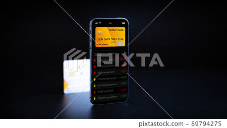 Online banking. Mobile phone with internet online bank app. Credit card on black background. Save money business wallet. 89794275