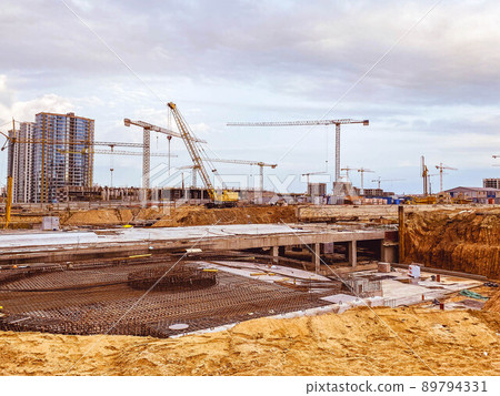 construction of a new residential area in the city center. for the construction of multi-storey buildings there are high-rise cranes. carrying large loads construction of a new residential area in the city center. for the construction of multi-storey buildings there are high-rise cranes. carrying large loads 89794331