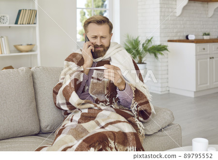 Sick man struggle with covid-19 consult with doctor on phone Sick man struggle with covid-19 consult with doctor on phone 89795552