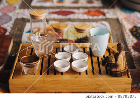 Preparing for a tea ceremony with a large company 89795873