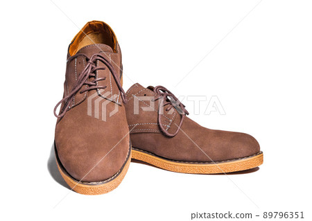 Pair of men's brown suede shoes isolated on white background 89796351