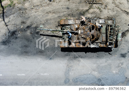 Kyiv region, Ukraine - May 15, 2022: War in Ukraine. Highway Kyiv - Zhytomyr. People take selfies against destroyed russian tank after russian atack in Febrary. 89796362