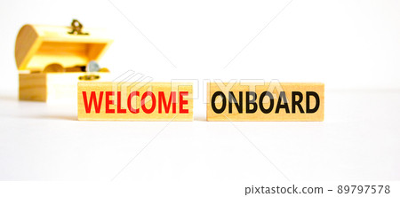 Welcome onboard symbol. Concept words Welcome onboard on wooden blocks on a beautiful white table white background. Wooden chest with coins. Business onboarding and welcome onboard concept copy space. Welcome onboard symbol. Concept words Welcome onboard on wooden blocks on a beautiful white table white background. Wooden chest with coins. Business onboarding and welcome onboard concept copy space. 89797578