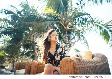 young pretty woman at swimming pool relaxing in chair, fashion look in lingerie at hotel, lifestyle people concept close up 89797908