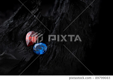 blue and red sapphir on black coal background 89799083