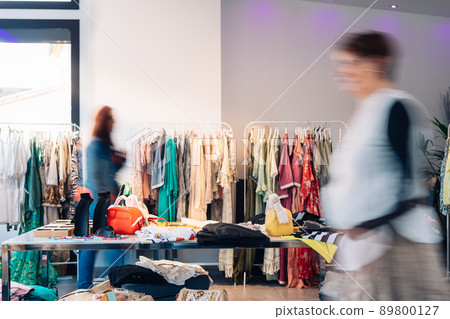 out of focus movement effect of two customers in a fashion shop. shopping concept. out of focus movement effect of two customers in a fashion shop. shopping concept. 89800127