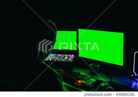 Hacker using computer to organise massive data breach attacks on public servers. cyber-attack concept Hacker using computer to organise massive data breach attacks on public servers. cyber-attack concept 89800186