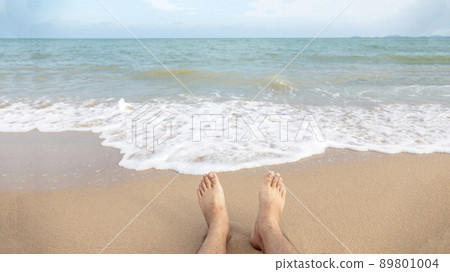 bare foot on ocean beach and sea wave in relax bare foot on ocean beach and sea wave in relax 89801004