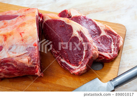 close up of pieces of striploin on wooden table close up of pieces of striploin on wooden table 89801017