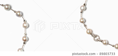 Freshwater pearl necklace with platinum hook and diamonds on white background. Collection of luxury jewelry accessories. Studio shot Freshwater pearl necklace with platinum hook and diamonds on white background. Collection of luxury jewelry accessories. Studio shot 89803733