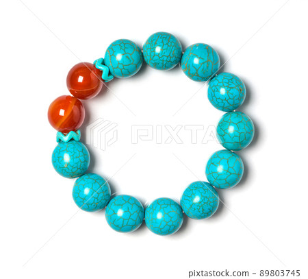 Turquoise with Carnelian Jewel or gems bracelet on white background. Collection of natural gemstones accessories. Studio shot Turquoise with Carnelian Jewel or gems bracelet on white background. Collection of natural gemstones accessories. Studio shot 89803745
