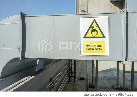 The industrial machine at the rooftop of the huge building. 89804132