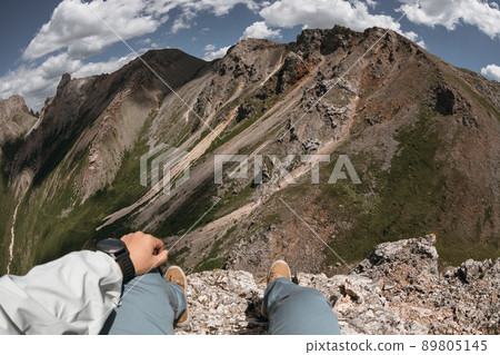 Hiker on high altitude mountain top enjoy the view 89805145