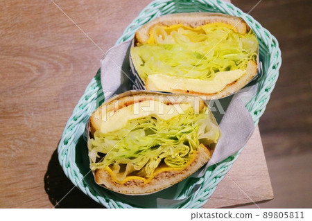 Two sandwiches in a blue dining bar Two sandwiches in a blue dining bar 89805811