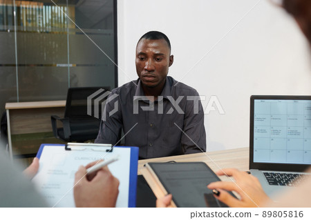 Nervous Black Man at Job Interview Nervous Black Man at Job Interview 89805816