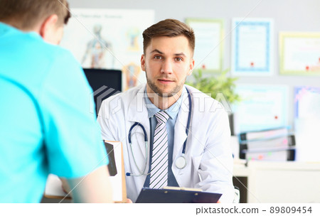 Doctor in uniform provide qualified diagnostic in clinic, specialist with stethoscope on neck 89809454