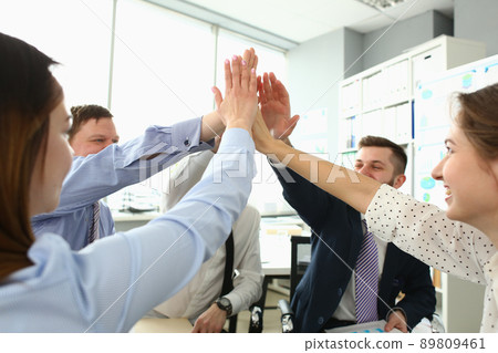 Witty colleagues performing high five gesture, successful profitable project, change future of corporation 89809461