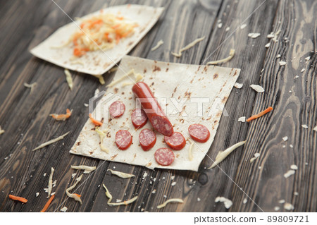 preparation of Shawarma. ingredients on wooden table.photo with 89809721