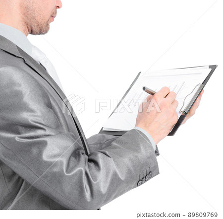 Young businessman makes a record. Isolated on a white background. 89809769