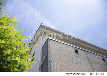 The siding on the outer wall has deteriorated and faded 89811461