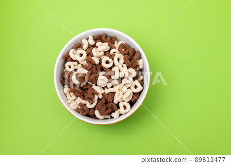 simple and chocolate cereals letters in orange bowl 89811477