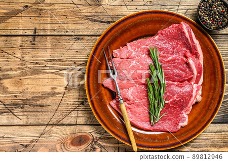 Raw veal meat chop steak on a plate. wooden background. Top view. Copy space Raw veal meat chop steak on a plate. wooden background. Top view. Copy space 89812946