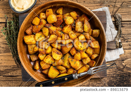 Fried potato - Patatas bravas traditional Spanish potatoes snack tapas. wooden background. Top view Fried potato - Patatas bravas traditional Spanish potatoes snack tapas. wooden background. Top view 89813879