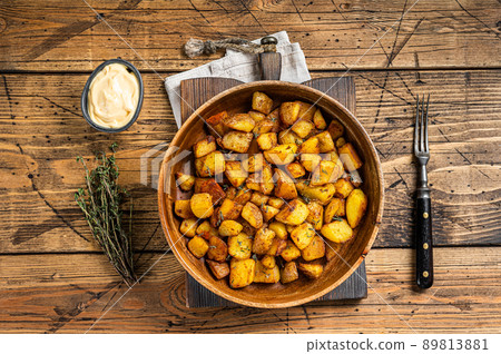 Fried potato - Patatas bravas traditional Spanish potatoes snack tapas. wooden background. Top view Fried potato - Patatas bravas traditional Spanish potatoes snack tapas. wooden background. Top view 89813881
