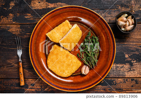 Chicken cordon bleu meat roll cutlet with ham and cheese. Dark wooden background. Top view 89813906