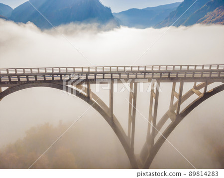 Montenegro. Dzhurdzhevich Bridge Over The River Tara foggy morning 89814283