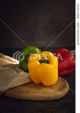sweet pepper of three colors on the board 89814293