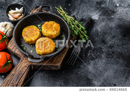 Baked vegetables patties cutlets for vegan burgers. Dark background. Top view. Copy space Baked vegetables patties cutlets for vegan burgers. Dark background. Top view. Copy space 89814668
