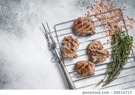BBQ grilled lamb loin steaks, chops cutlets on grii. White background. Top view. Copy space BBQ grilled lamb loin steaks, chops cutlets on grii. White background. Top view. Copy space 89814723