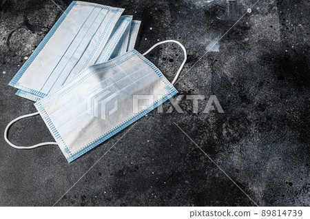 Doctor mask and corona virus protection. Disposable procedural face mask with malleable nose clip. Black background. Top view 89814739