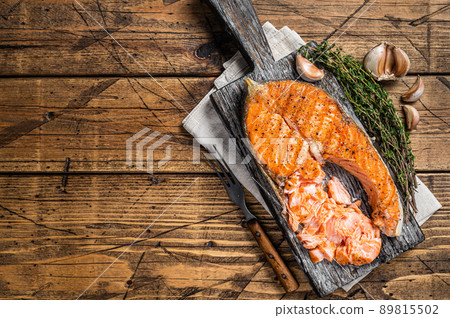 grilled Salmon Trout Fish Steak on a wooden board with herbs. Wooden background. Top view. Copy space 89815502