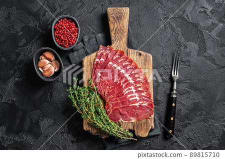 Sliced Turkish bacon Pastrami, roasted beef meat. Black background. Top view 89815710