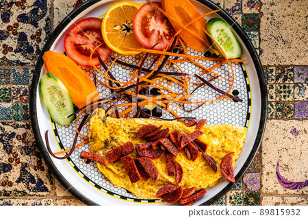 Omelet with sausage and vegetables in white plate Omelet with sausage and vegetables in white plate 89815932