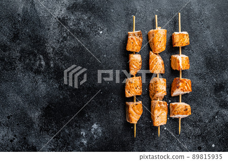 Grilled salmon kebab skewers. Black background. Top View. Copy space Grilled salmon kebab skewers. Black background. Top View. Copy space 89815935