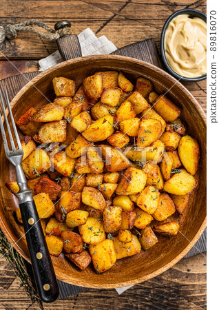 Fried potato - Patatas bravas traditional Spanish potatoes snack tapas. wooden background. Top view Fried potato - Patatas bravas traditional Spanish potatoes snack tapas. wooden background. Top view 89816070