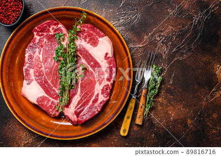 Raw Chuck eye roll steaks organic beef meat. Dark background. Top view. Copy space Raw Chuck eye roll steaks organic beef meat. Dark background. Top view. Copy space 89816716